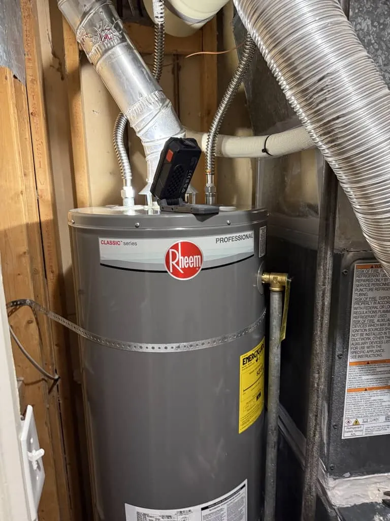 Technician installing a water heater
